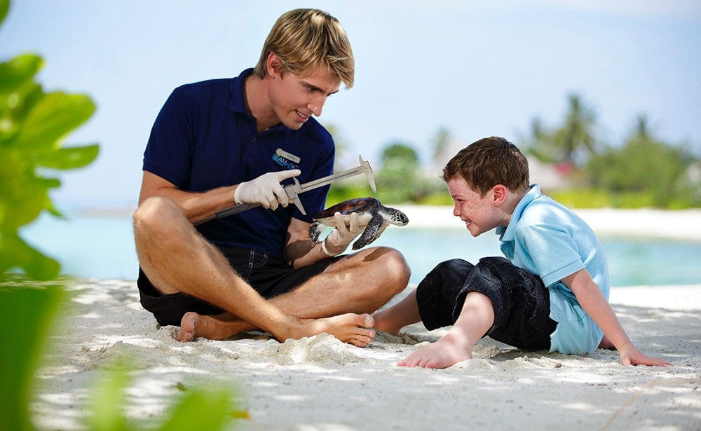 Fun With Kids. Four Seasons Kuda Huraa, Maldives Luxury Surfing.