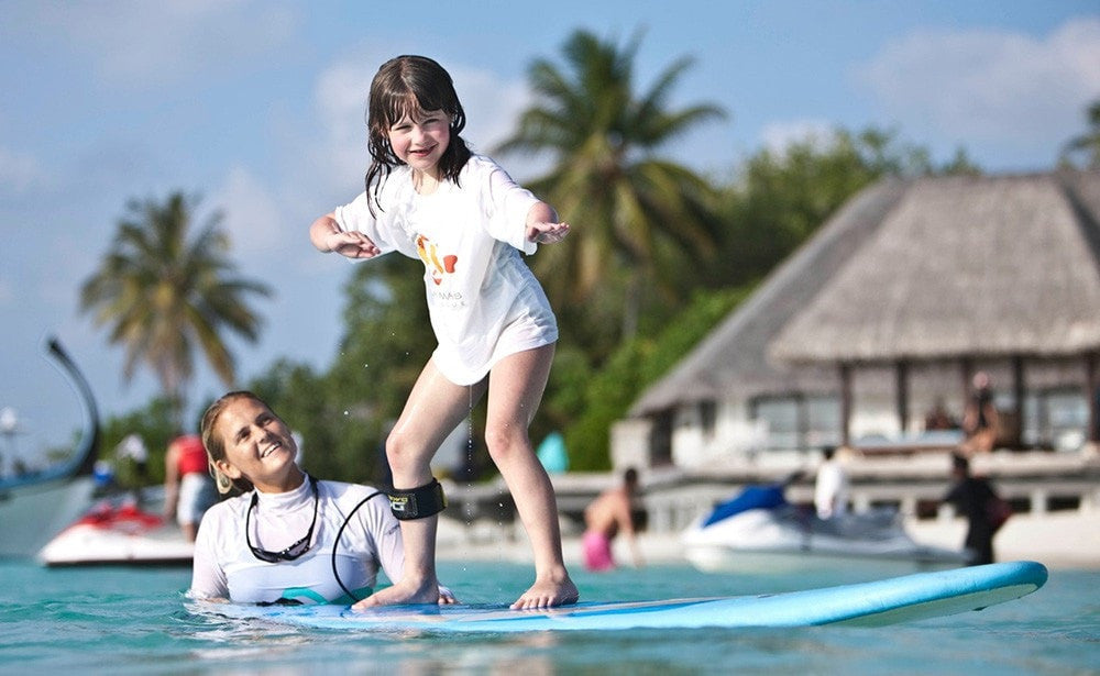 Balancing the Water Ride. Four Seasons Kuda Huraa, Maldives Luxury Surfing.